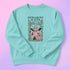 Comfort Colors garment-dyed sweatshirt featuring 'Patriarchy Slayer' design with pink armored knight holding sword and banner reading 'Burn It Down', surrounded by decorative floral border with roses and leaves. Made from 80% ring-spun cotton and 20% polyester with relaxed fit and rolled-forward shoulders. Available in lavender purple and seafoam green colorways, sizes S-3XL unisex, featuring sustainable made-to-order production with OEKO-TEX certified low-impact dyes and zero waste manufacturing process.
